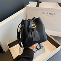 Chic black lychee grain bucket bag with gold hardware and stylish brand gift packaging - Black