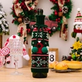 Copribottiglia di vino natalizio in maglia con fiocchi di neve e pompon - Verde