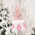 Gnomo di Natale rosa con paillettes e barba bianca appeso a un ramo bianco - Personaggio Rosa