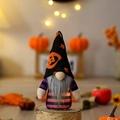 Lighted Halloween gnome decor with purple striped suit and orange pumpkin hat on wood base - Demon Pumpkin Hat Style