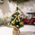 Mini Christmas tree with gold balls, silk bow, and LED star lights on a burlap base - Gold