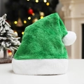 Detailed close-up of green plush Christmas hat with soft white faux fur trim and pompom - Green