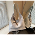Close-up of artistic textured tote bag featuring a coffee cup charm and leather straps - Blue (With Pendant)