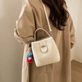 Creamy white pebble leather crossbody bucket bag with a cute bear charm for women - White with Pendant