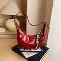 Glossy red crescent shoulder bag with LOVE & DESIRE text and chocolate charm - Red