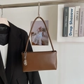 Minimalist caramel brown underarm bag with a silver pendant in a stylish setting - Brown with Pendant