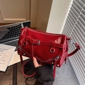 Chic red patent leather bowling bag with silver zipper accents and punk buckle details - Red