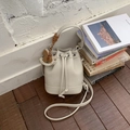 Beige lychee pattern leather bucket bag with drawstring and cute horse charm - Light Grey