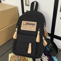 Mochila pequeña de nailon negro con detalles de cuero marrón y tiradores de cremallera - Sin colgante / Negro