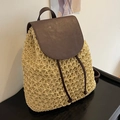 Handcrafted beige straw backpack with dark brown leather flap and drawstring closure - Off White