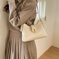 Elegant cream white faux leather hobo underarm bag with gold oval metal buckle and strap - White