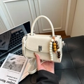 Cream white glossy leather crossbody bag with vintage beads and metal clasp detail - White