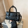 Elegant black handbag with white contrast stitching and silver metal buckle detail - Black