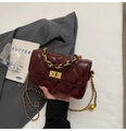 Close-up of wine red quilted diamond pattern shoulder bag with gold chain strap detail - Ankara Red