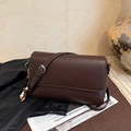 Detail of dark brown litchi pattern leather bag with ethnic beads and silver buckle - Coffee with Pendant