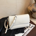 Detail of white lychee leather square bag with decorative woven bead fringe and silver metal - White with Pendant