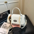 White faux leather crossbody bag with top handle and colorful wooden bead charms - White