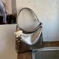 Silver metallic pleated shoulder bag with oversized hobo design and plush pendant - Titanium Gold With Pendant