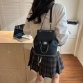 Chic black faux leather backpack featuring silver chain straps and a metal twist lock - Black
