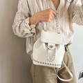 Chic cream white leather backpack for women featuring silver chain and metal turn-lock - White
