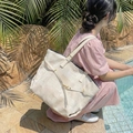 Chic beige oversized tote bag with checkered texture and gold hardware detailing - Off-white