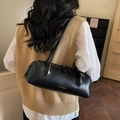 Minimalist black cylinder shoulder bag in matte leather featuring JL CHIC gold logo print - Black