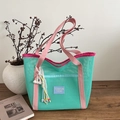 Contrast mesh tote bag in mint green and pink featuring a colorful beaded tassel charm - With Pendant / Green