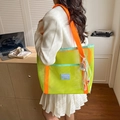 Neon green mesh tote bag with orange straps and colorful tassel on a female model - With Pendant / Yellow