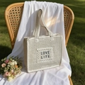 Beige crochet straw tote bag with embroidered LOVE LIFE patch and top handles - Off White