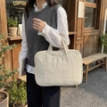 Minimalist ivory quilted laptop bag with a square stitched pattern for commute - Off-white