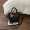 Retro black litchi texture bucket bag with adjustable strap and wooden horse pendant - Black