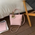 Pink lychee grain leather bucket bag with horse charm and detachable crossbody strap - Pink