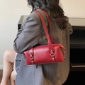 Red Boston-style shoulder bag with silver studs on a dark grey blazer outfit - Burgundy
