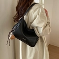 Chic black leather shoulder bag with white contrast stitching and heart charms - Black