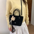 Black suede bucket bag with bear charm and white logo, crossbody and handheld style - Black