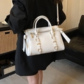 Chic white pleated faux leather tote bag with gold metal buckle and knotted side details - Off White