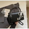 Detail of black vintage square bag with white lace bow and pearl heart charm accents - With Pendant / Black