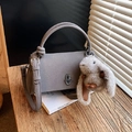 Grey pebbled leather crossbody bag with metal twist lock and cute bunny pendant charm - Gray With Pendant