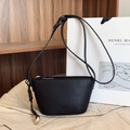 Black lychee texture crossbody bag with knot detail and silver metal pendant - Black
