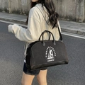 Black large capacity travel tote bag with white graphic print shown on a model - Black
