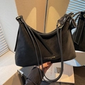 Minimalist black matte leather handbag with gold Fashion and Bags text and slim shoulder strap - Black