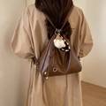 Vintage dark brown soft leather backpack with a cute white plush doll charm - Brown with Pendant