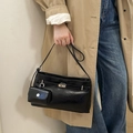 Large black leather bucket bag with silver rotating lock and mini pouch accessory - Black