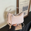 Minimalist light pink crescent bucket bag in soft matte leather with silver buckle - Pink