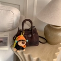 Vintage brown textured bucket bag with a colorful knitted puppy charm and leather straps - With Pendant / Coffee