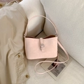 Pink lychee textured bucket bag with silver buckle and detachable shoulder strap - Pink Without Charm