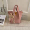 Pink lychee grain leather bucket bag with top handle and brown plush bear charm accessory - Pink with Pendant