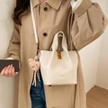 Minimalist cream white leather bucket bag with top handle and bear charm pendant - White with Pendant