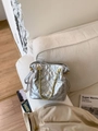 Chic silver metallic quilted bucket bag with gold chain handle and drawstring closure - Silver