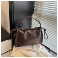 Minimalist dark brown leather shoulder bag with pleated design and knotted handles - Brown